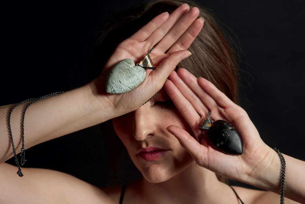 Santa Fe model showcasing contemporary handmade jewelry in Patina Gallery.