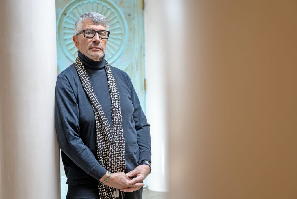 Portrait of Ivan Barnett, creative consultant and coach, at entrance to Serious Play office, Santa Fe, New Mexico.